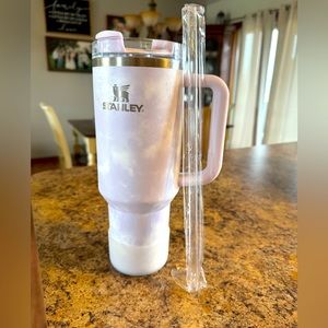 Purple tie dye Stanley with new straw and silicone base cover